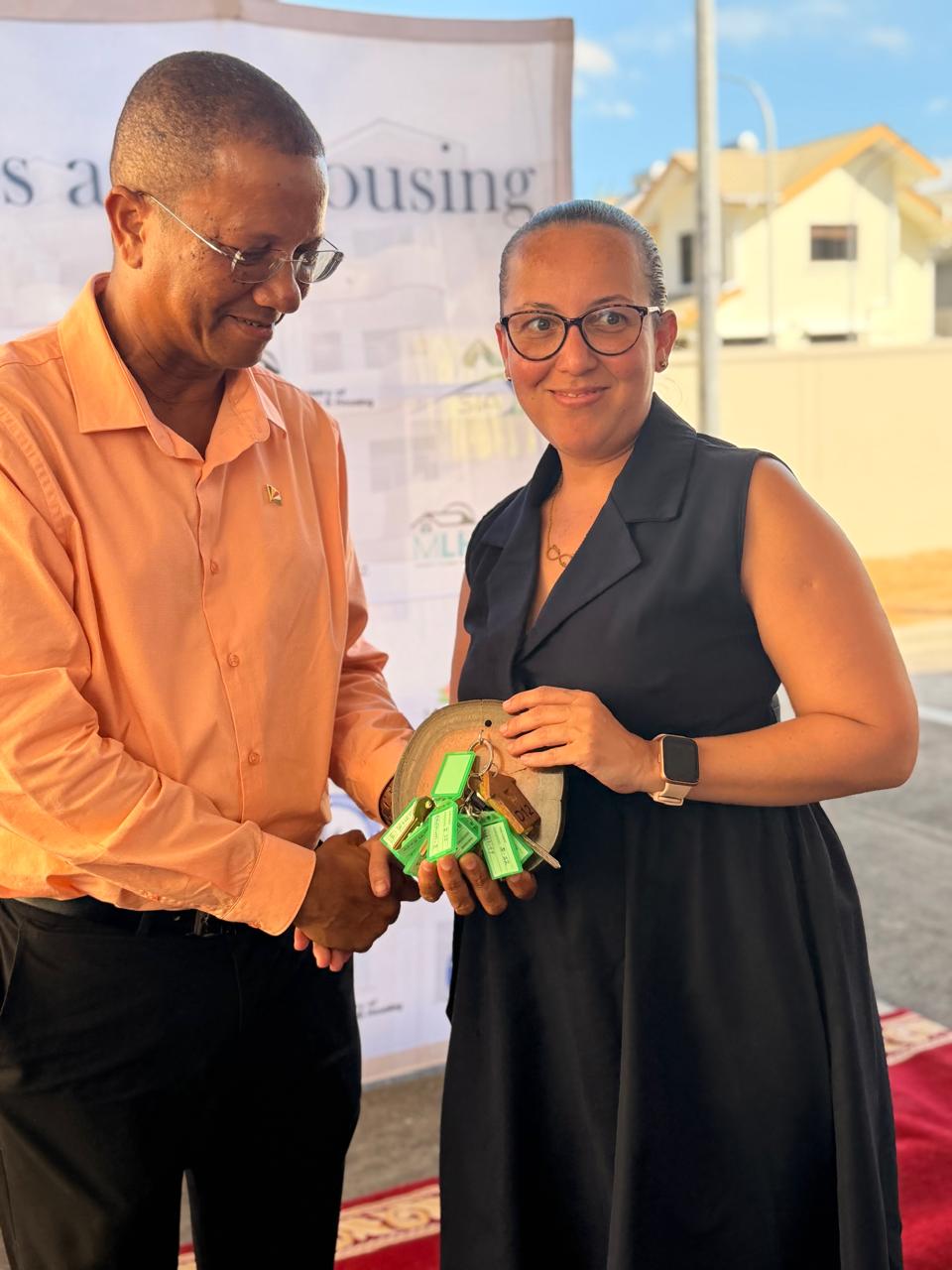 32 families receive keys to their new mid-range condominiums at Perseverance.